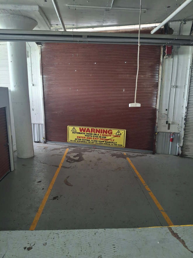 Protected Indoor Drive-In Loading Bay Covered Drive-In Loading Zone with 2-Minute Timer Warning Door